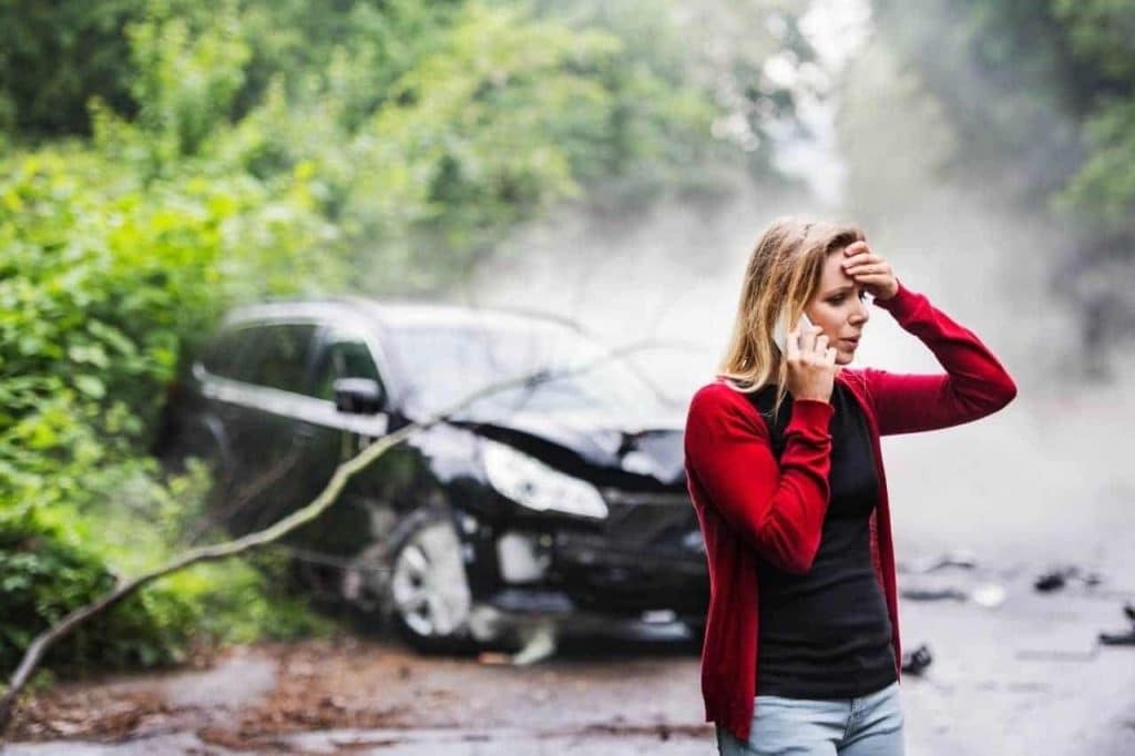 woman calling the police after an accident